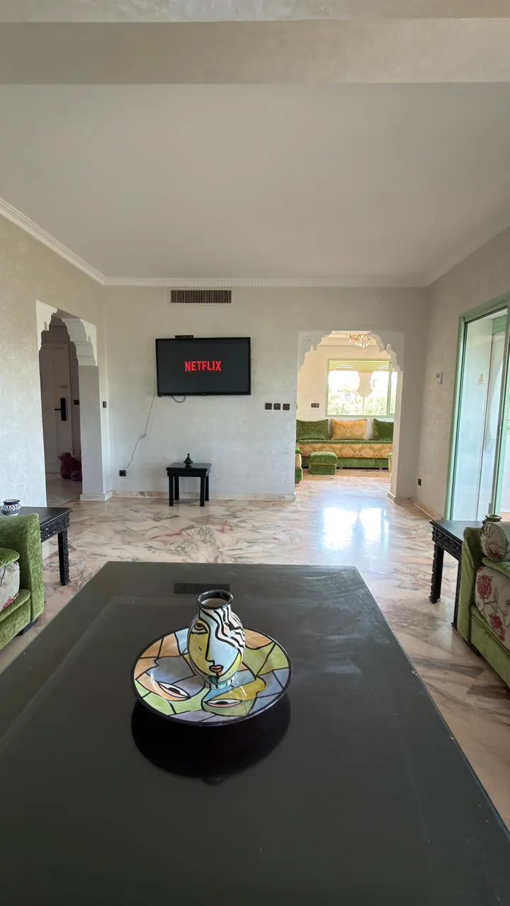 Duplex living room with green Moroccan salon