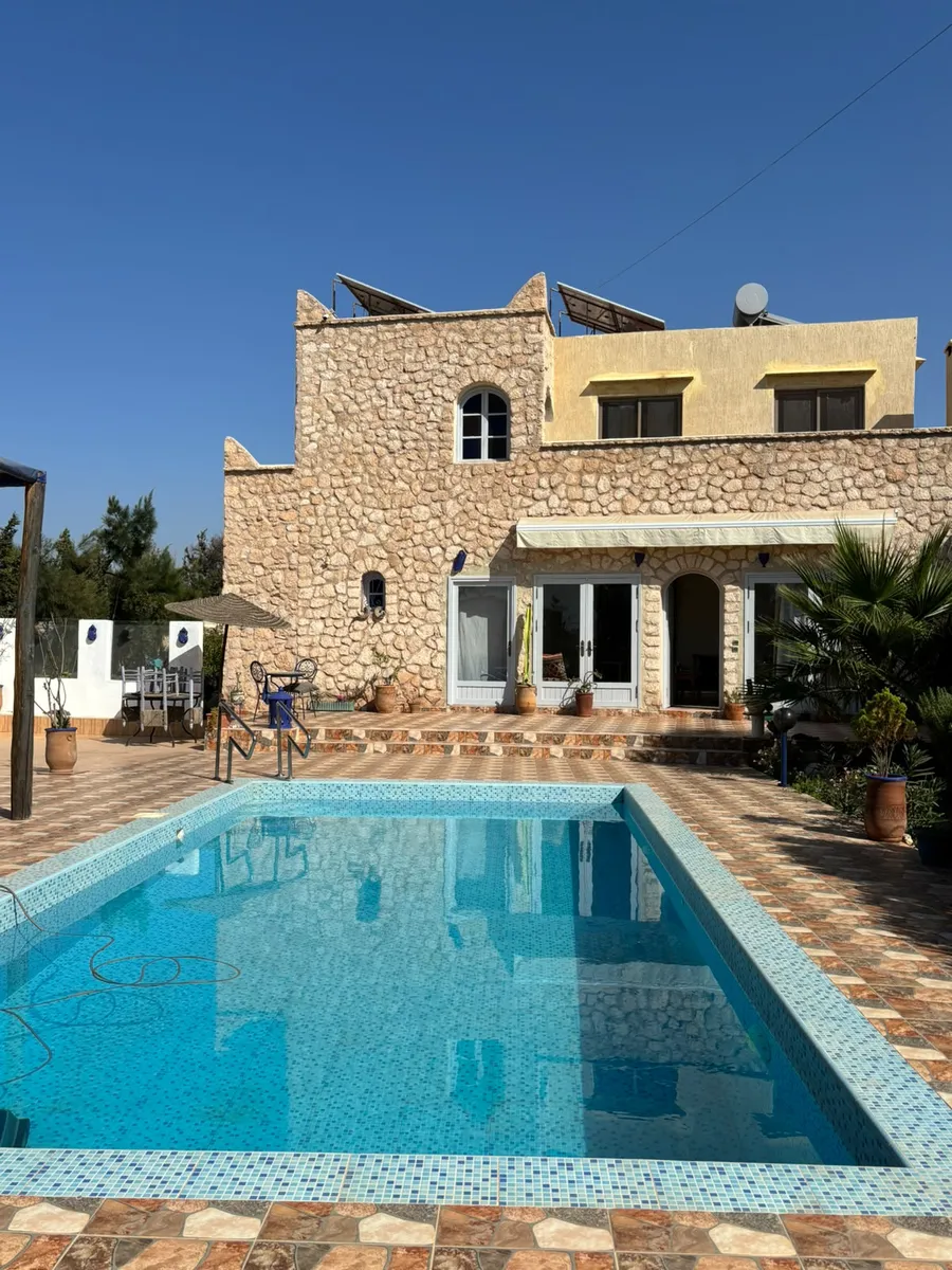 Stone villa with a tiled pool